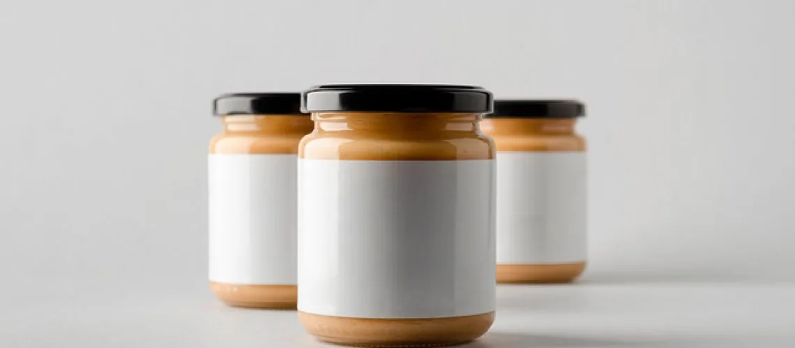 Three unbranded jars of spread with blank labels